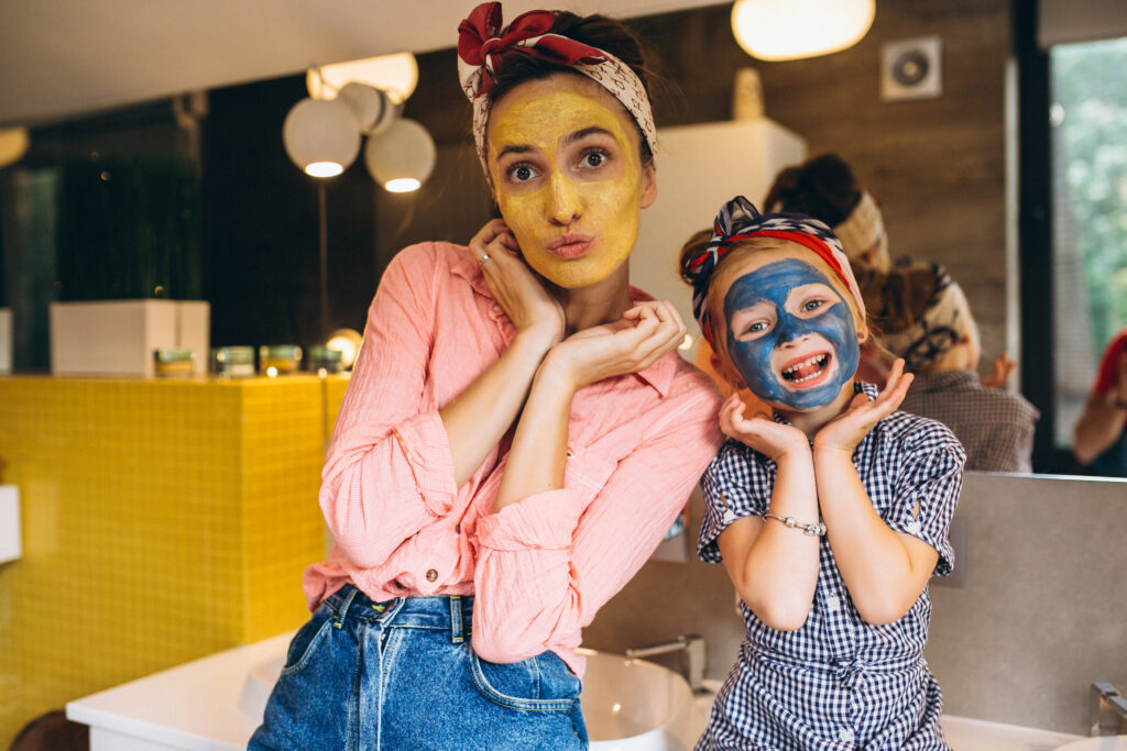 Mother and daughter doing facial